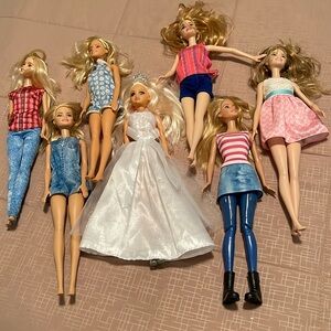 Seven (7) Barbie and Friends Dolls ready for summer fun vacation